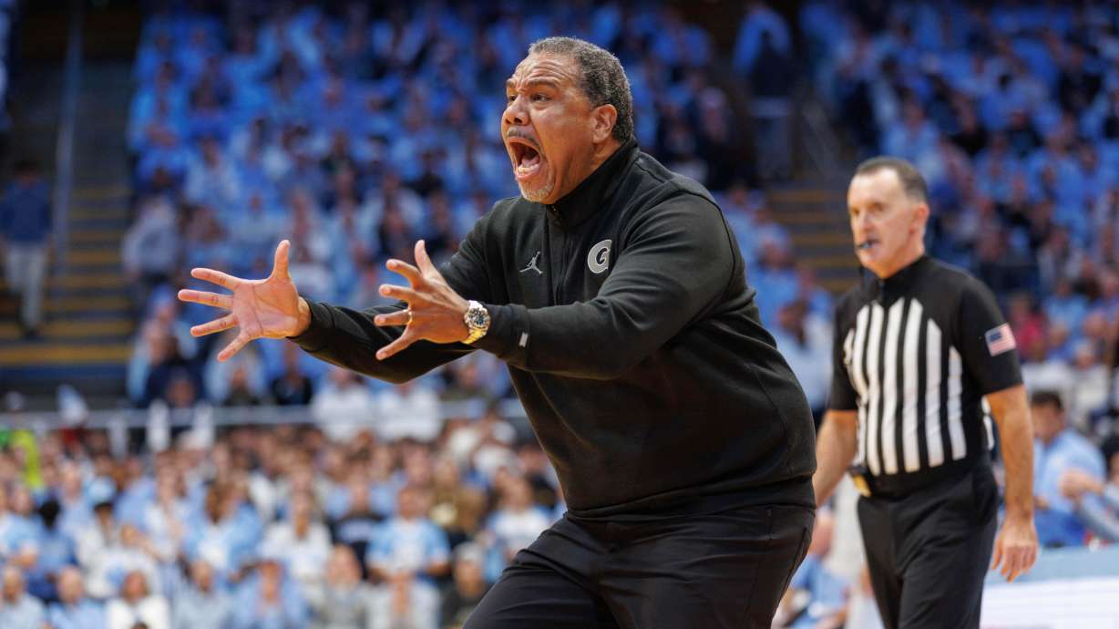 Georgetown head coach Ed Cooley shouts toward the court as a timeout starts during an NCAA college basketball game against North Carolina in Chapel Hill, N.C., Sunday, Dec. 7, 2025.