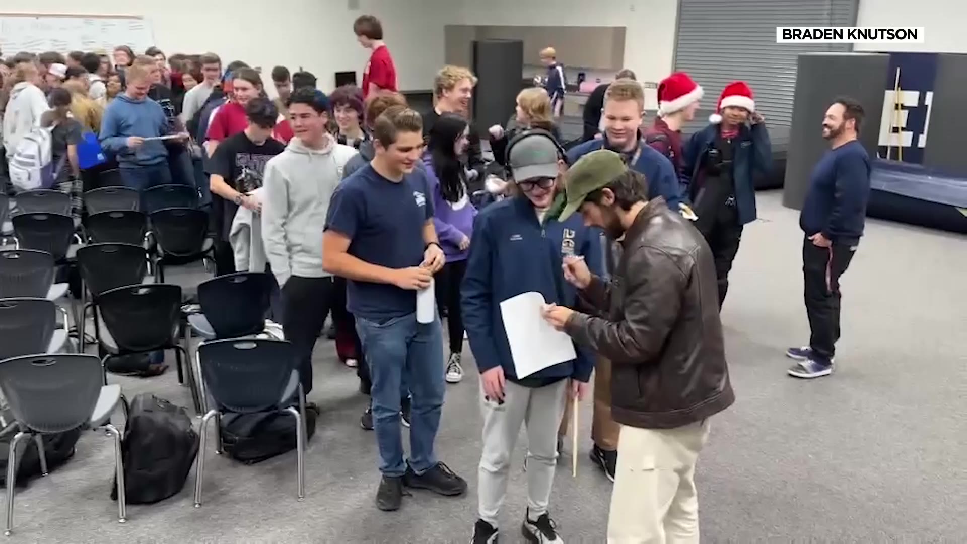 The 200-plus high school students lined up to get Vincent Lima’s autograph after he surprised them in class.
