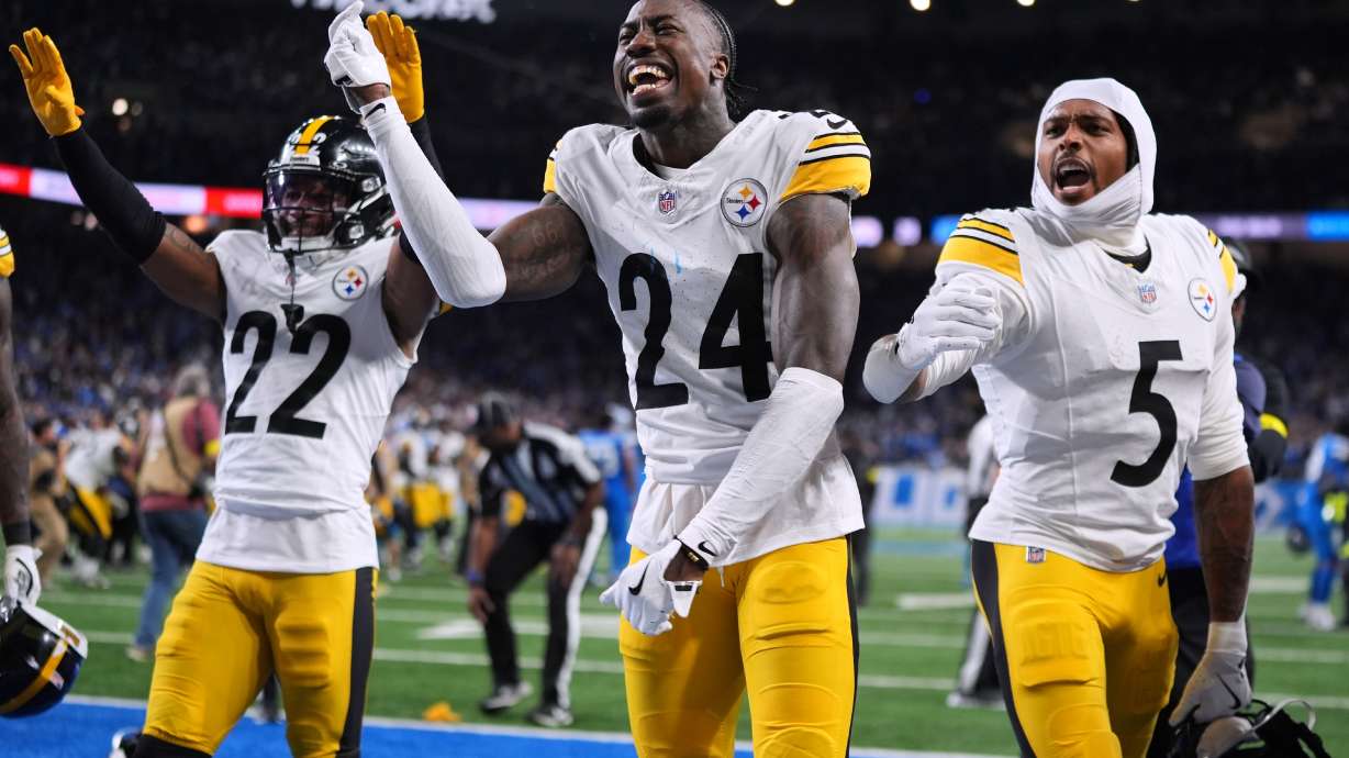 Pittsburgh Steelers' Asante Samuel Jr. (22) Joey Porter Jr. (24) and Jalen Ramsey (5) celebrate after Pittsburgh won an NFL football game against the Detroit Lions, Sunday, Dec. 21, 2025, in Detroit.