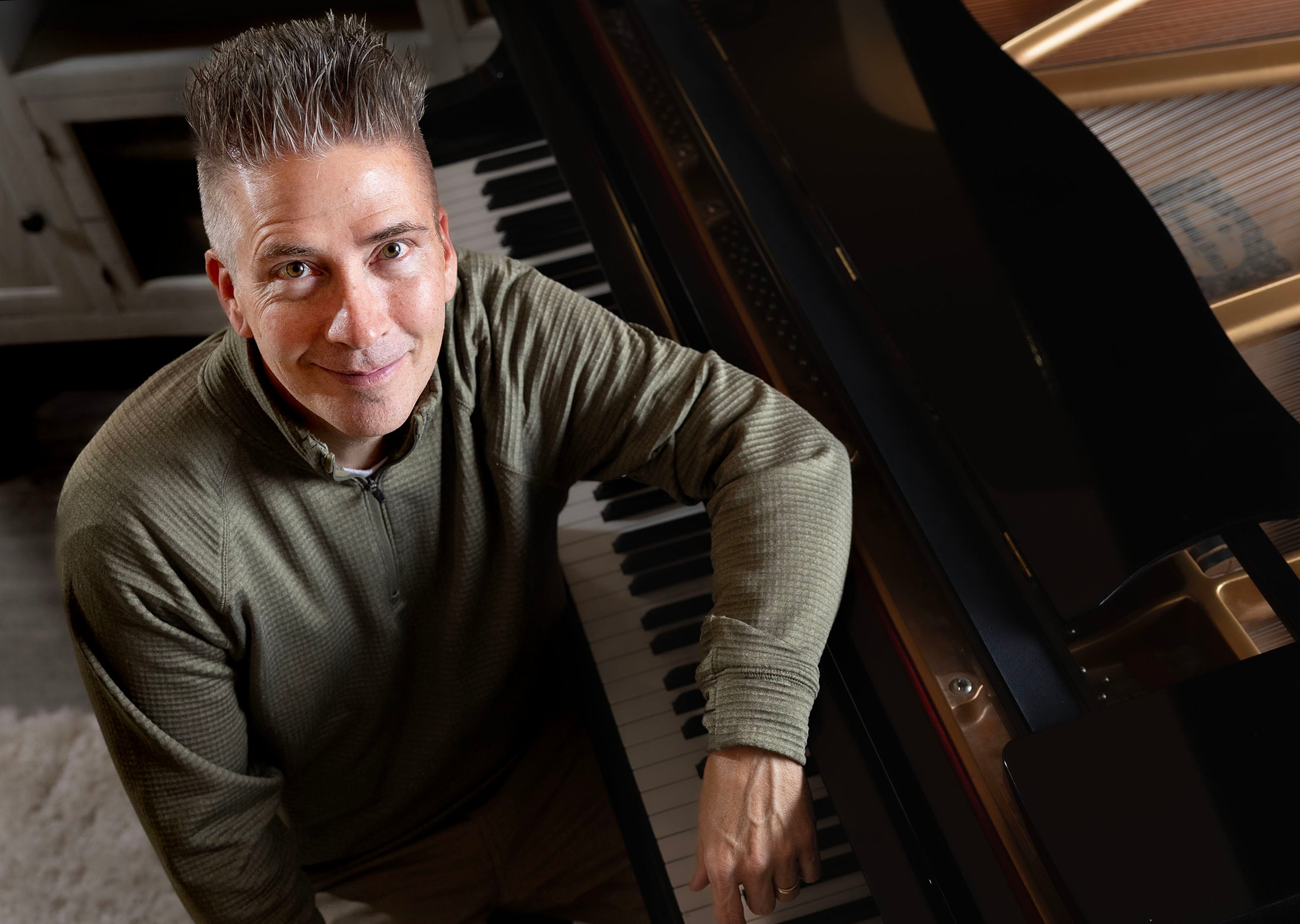 Billboard-charting composer and pianist David Tolk is photographed at his home in Draper on Dec. 10.