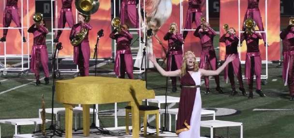 Musician surprises Herriman High School marching band while on tour