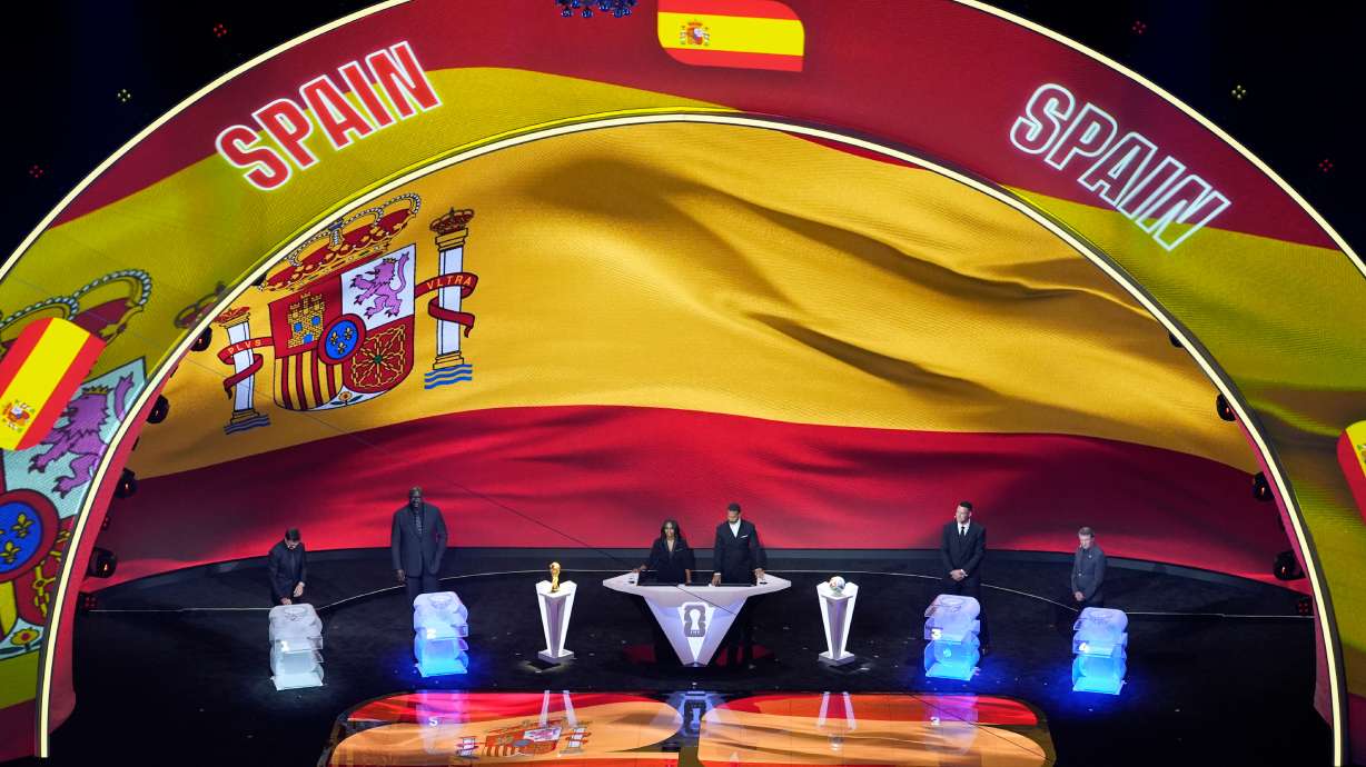 From left; former NFL player Tom Brady, former NBA player Shaquille O'Neal, broadcaster Samantha Johnson, former England soccer captain Rio Ferdinand, New York Yankees' Aaron Judge and former NHL player Wayne Gretzky participate in the draw for the 2026 soccer World Cup at the Kennedy Center in Washington, Friday, Dec. 5, 2025.