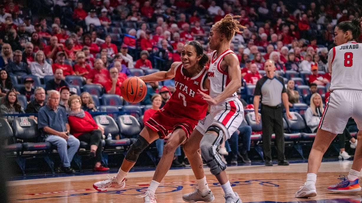 Utah's Lani White drives to the basket against an Arizona defender at McKale Center in Tucson, Arizona, on Dec. 22, 2025.