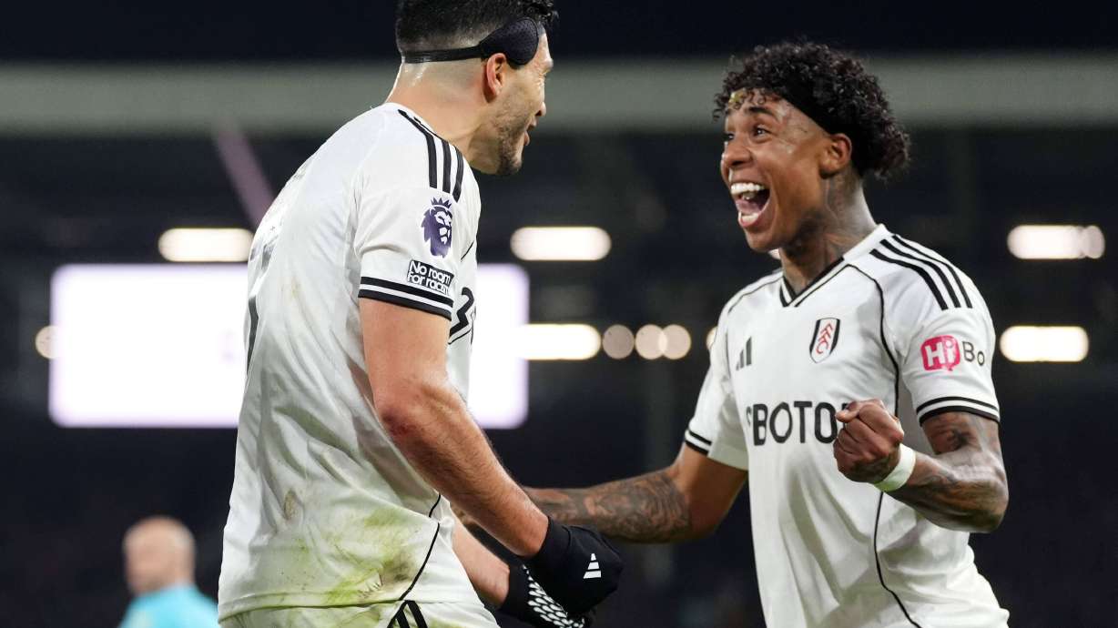 Fulham's Raul Jimenez, left, celebrates scoring their side's first goal of the game during the Premier League match between NottinghamForest and Fulham, in London, Monday Dec. 22, 2025.