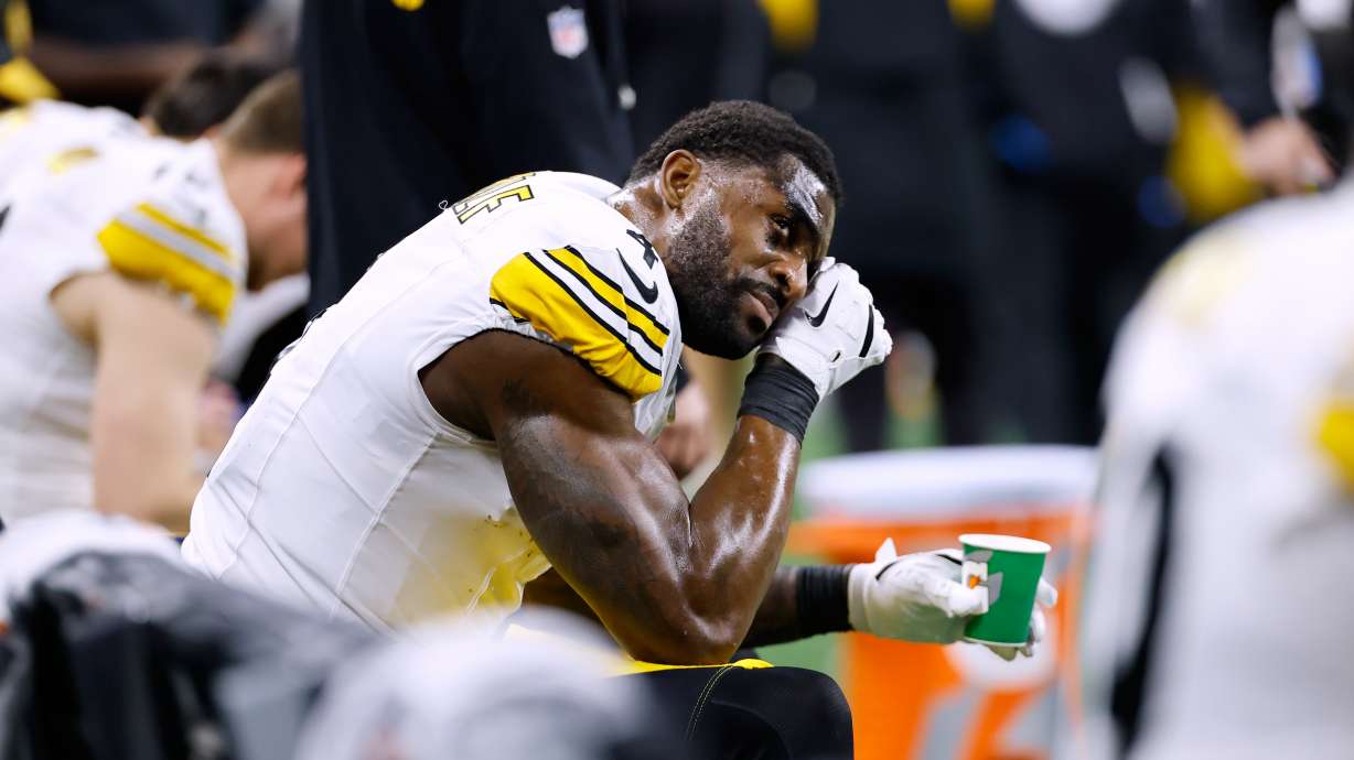 Pittsburgh Steelers' DK Metcalf wipes his face on the bench during the second half of an NFL football game against the Detroit Lions, Sunday, Dec. 21, 2025, in Detroit.