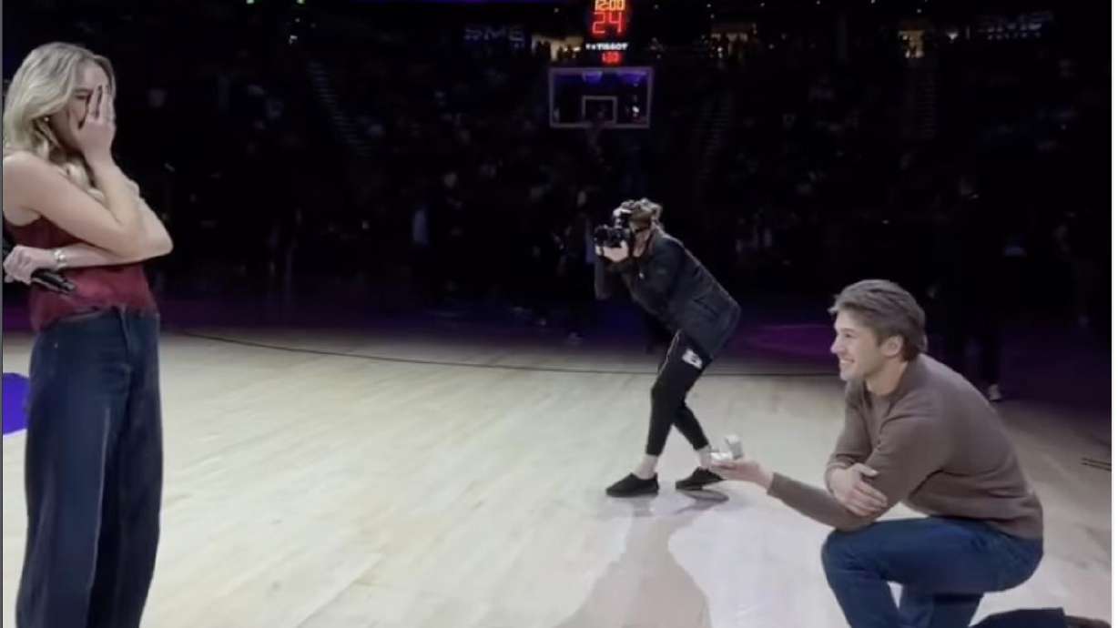 Bridger Gose proposes to his girlfriend Paige Anne after she finishes singing the national anthem at a Utah Jazz game in Salt Lake City on Dec. 20.
