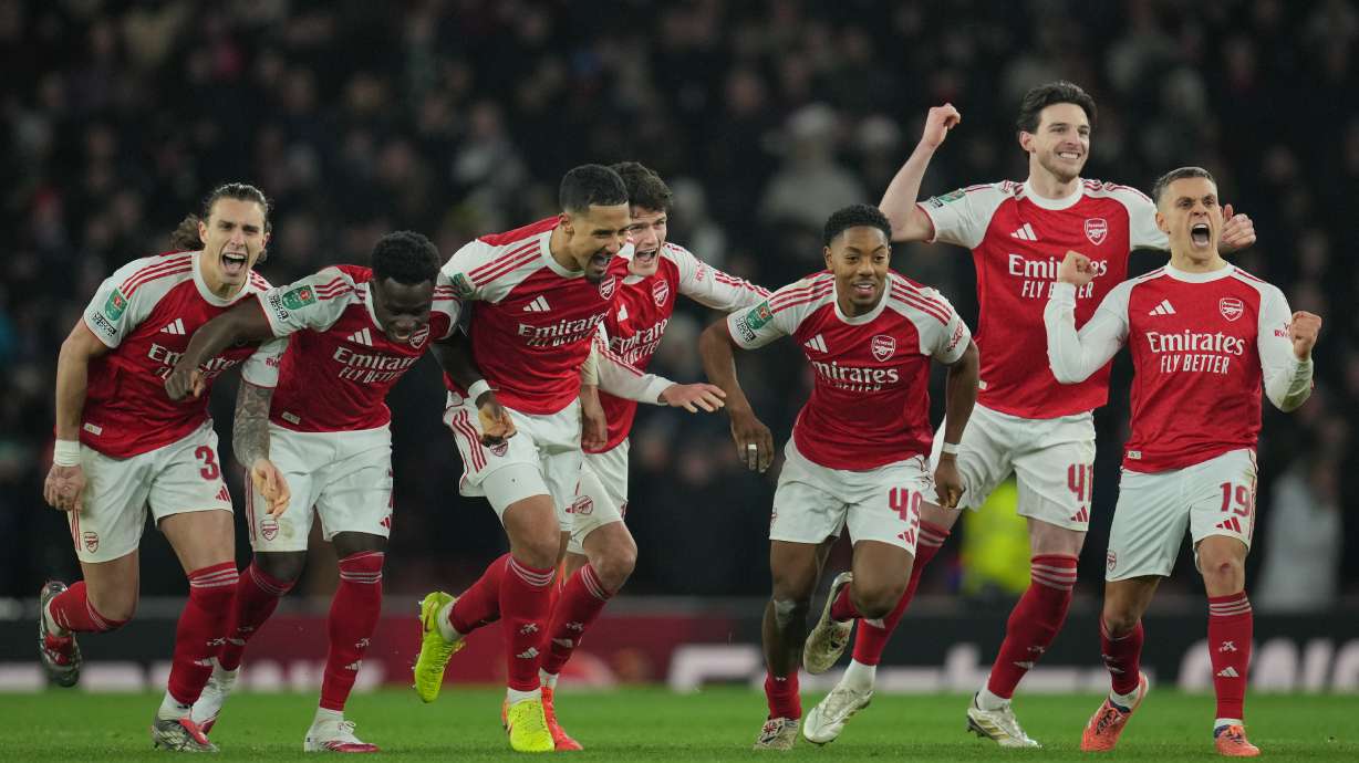 Arsenal players celebrate after winning in a penalty shootout the English Football League Cup quarter-final soccer match between Arsenal and Crystal Palace in London, Tuesday, Dec. 23, 2025.