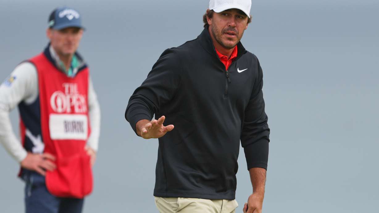 FILE - Brooks Koepka, of the United States, acknowledges the crowd on the 5th green during the first round of the British Open golf championship at the Royal Portrush Golf Club in Northern Ireland, July 17, 2025.
