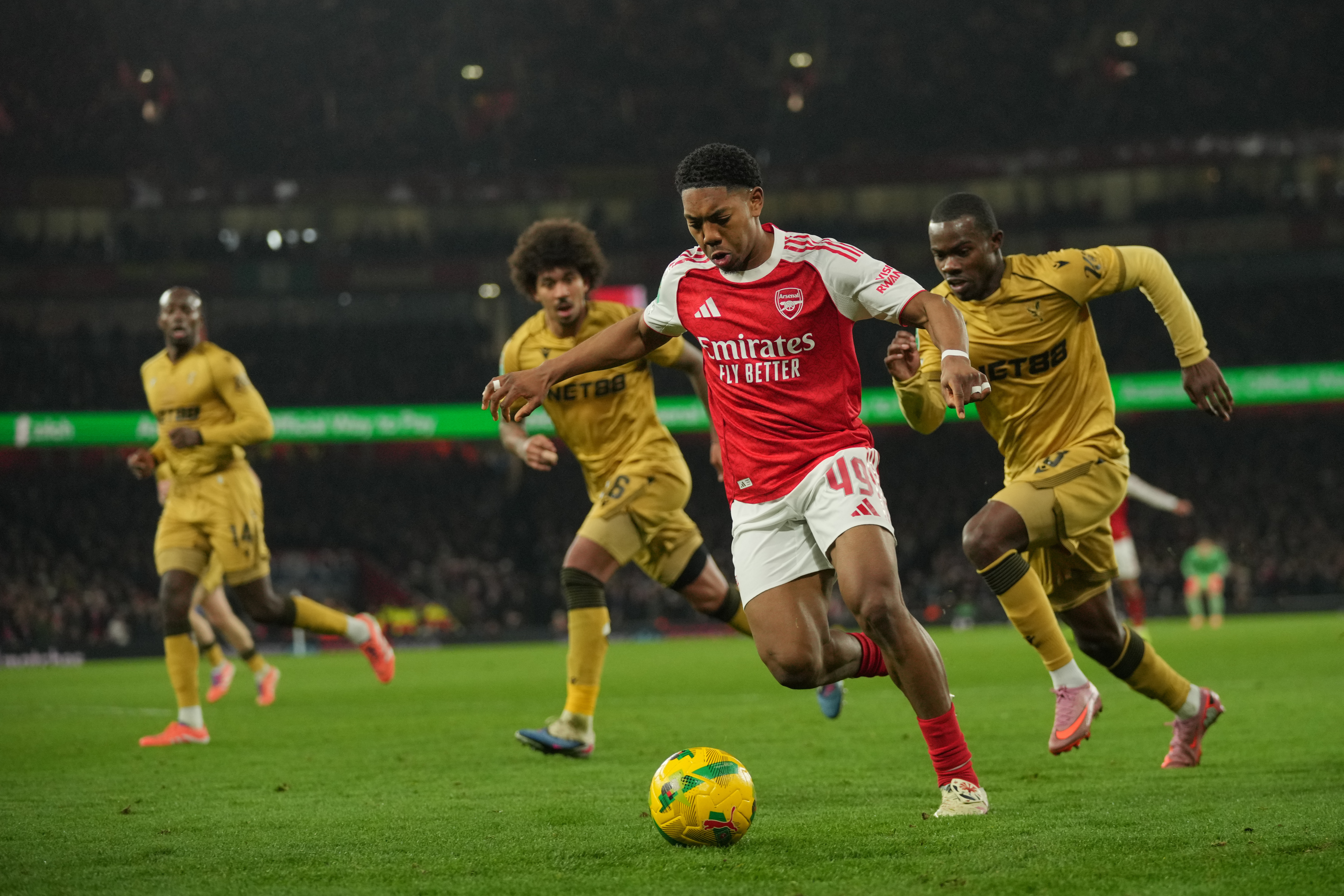 Arsenal's Myles Lewis-Skelly in action during the English Football League Cup quarter-final soccer match between Arsenal and Crystal Palace in London, Tuesday, Dec. 23, 2025.