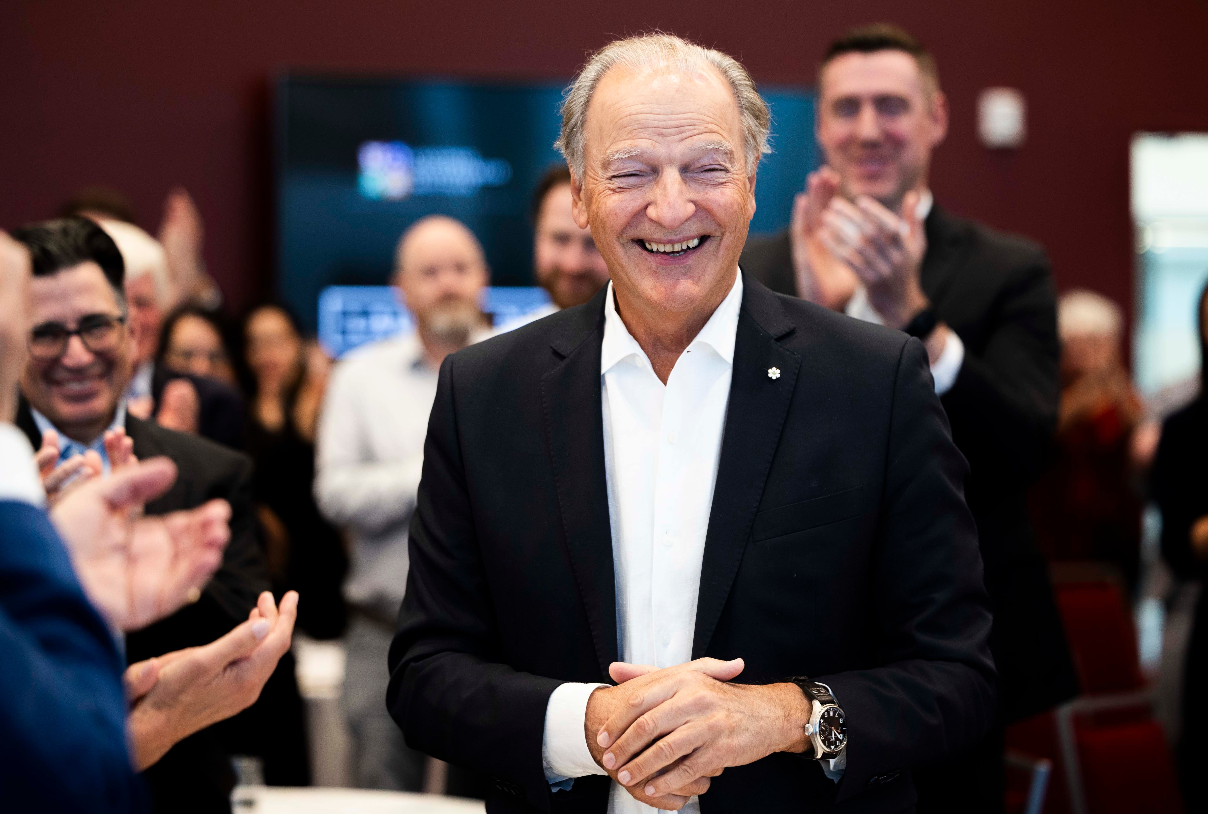Pierre Lassonde smiles and thanks the crowd during a standing ovation to him at a ceremony celebrating a donation by the Lassonde family of $25 million to the Lassonde Entrepreneur Institute at the University of Utah, at the David Eccles School of Business in Salt Lake City on May 2.