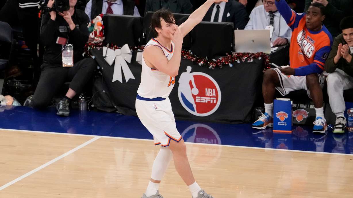New York Knicks guard Tyler Kolek (13) reacts after scoring a three point goal during the second half of an NBA basketball game against the Cleveland Cavaliers, Thursday, Dec. 25, 2025, in New York.