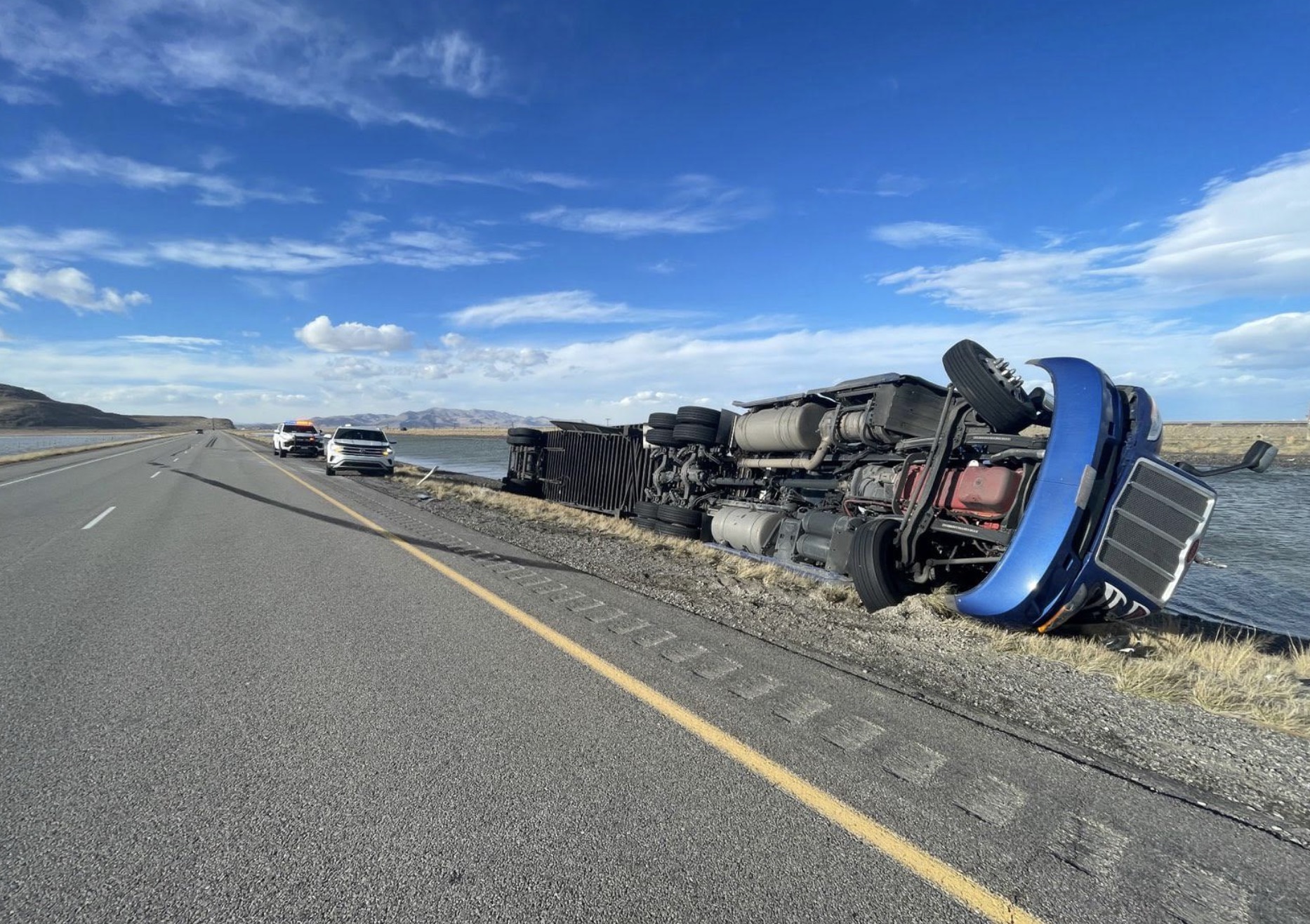 Utah Highway Patrol troopers respond to a semitruck rollover on I-80 in Tooele County on Thursday. Authorities said strong wind tipped over the vehicle.