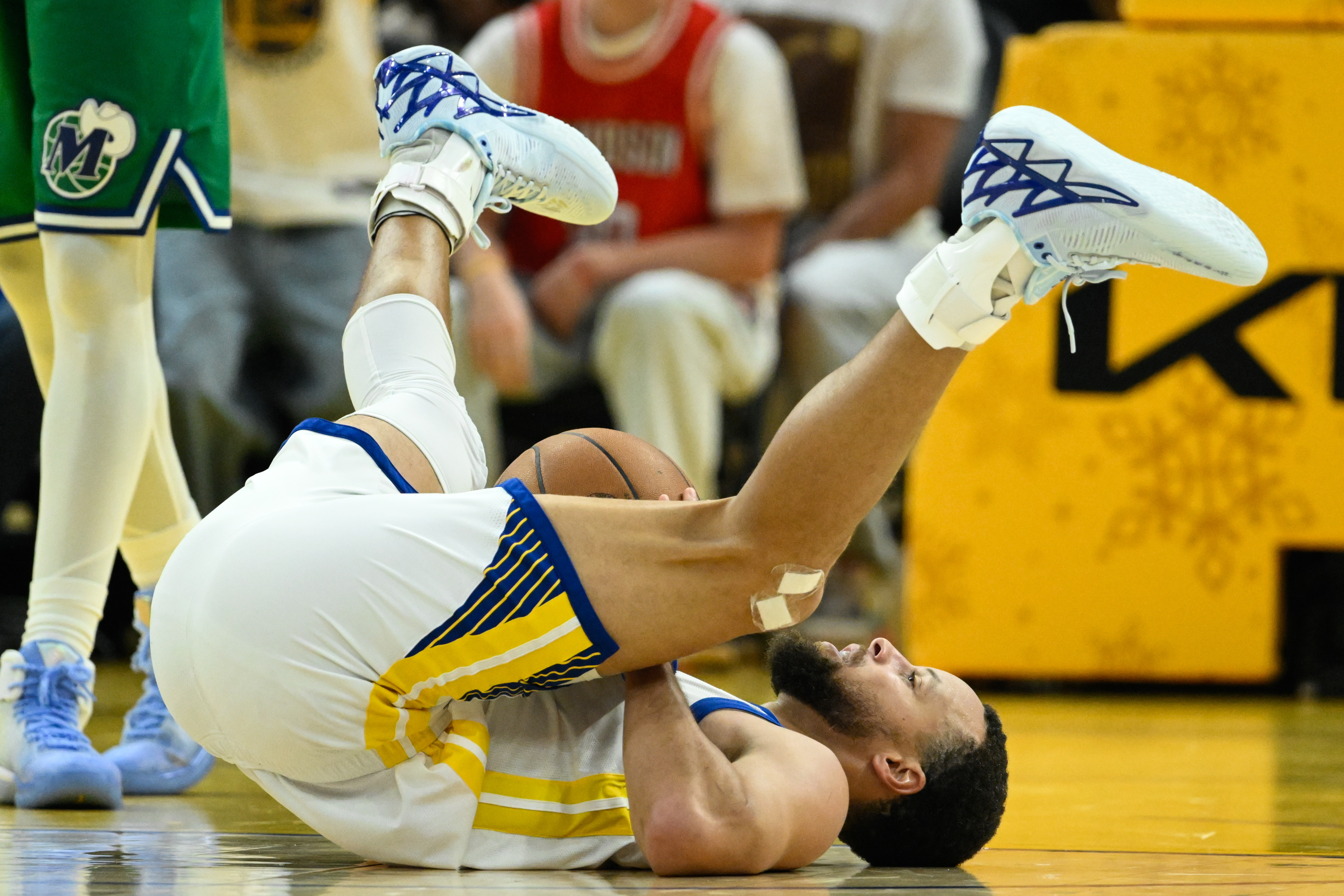 Golden State Warriors guard Stephen Curry reacts after getting fouled by the Dallas Mavericks during the first half of an NBA basketball game, Thursday, Dec. 25, 2025, in San Francisco.
