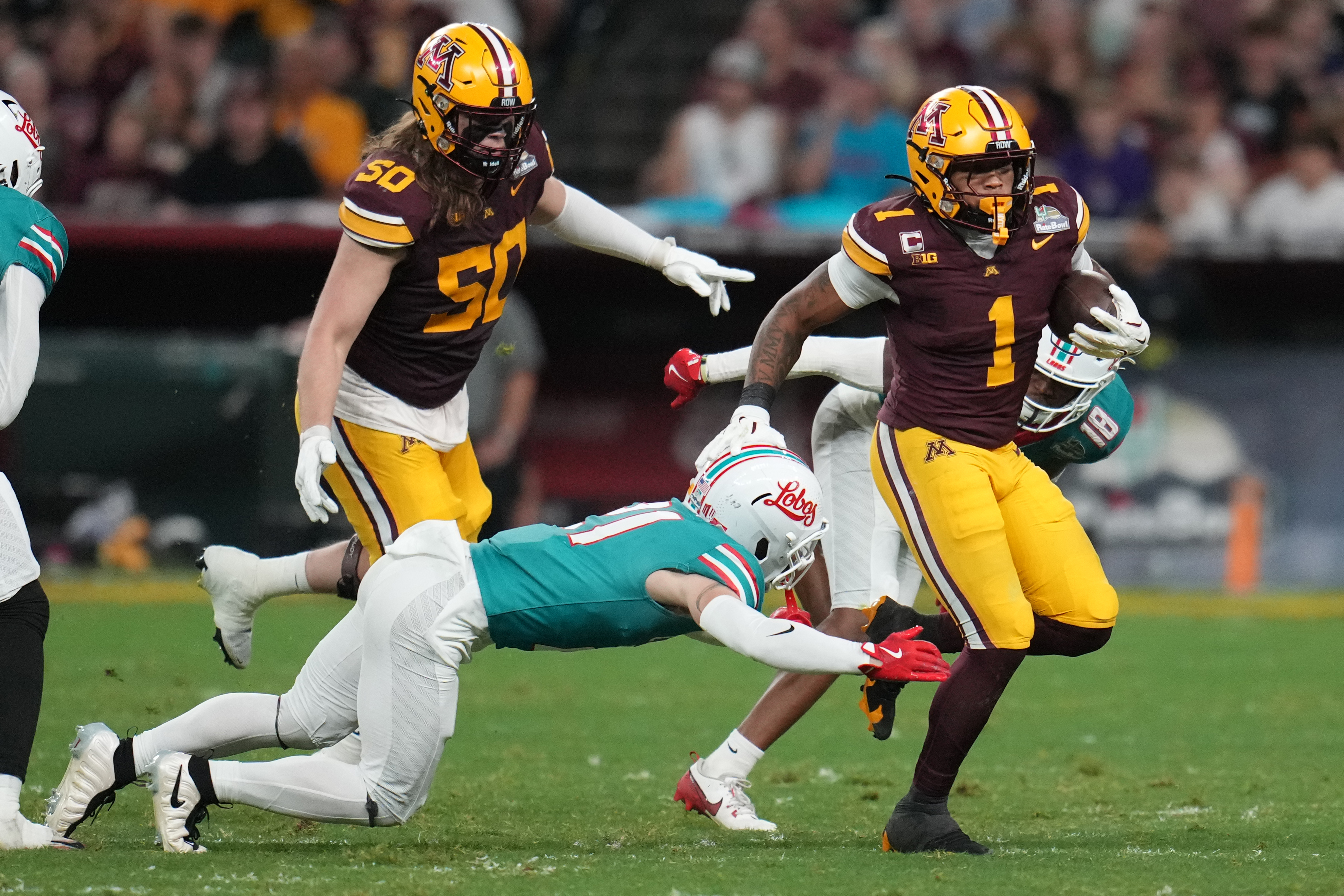Smith's diving TD catch in overtime sends Minnesota to 20-17 win over New Mexico in Rate Bowl