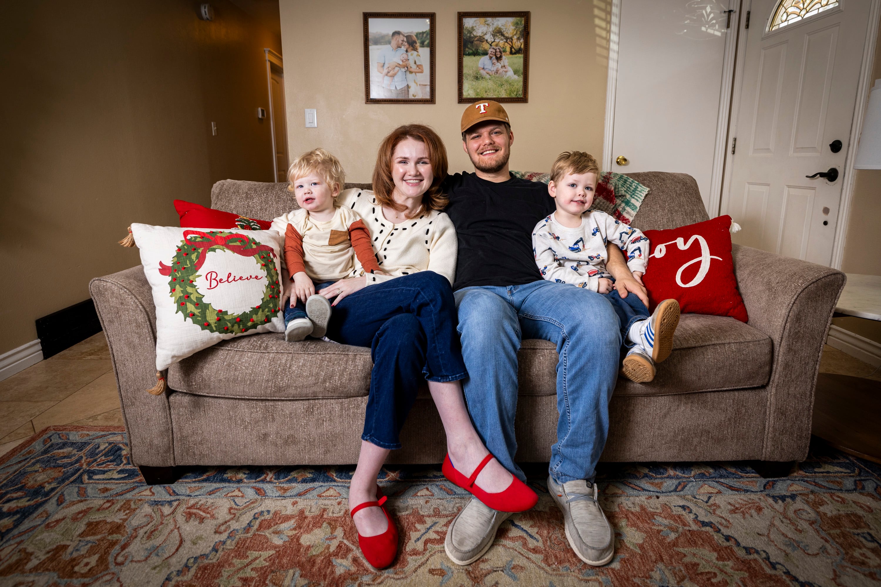 Tiffany and Alex Fransen pose for a portrait with their sons Andy, 1, left, and Robbie, 3, right, at their family's home in Highland on Dec. 17.