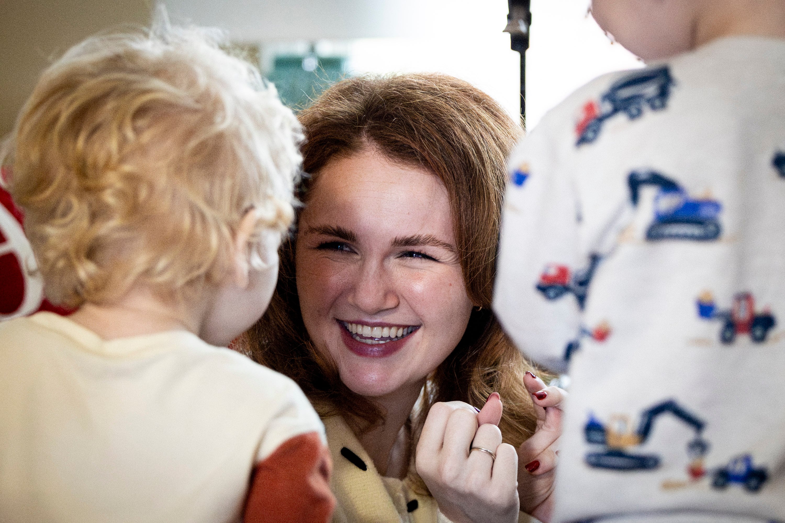 Tiffany Fransen plays peek-a-boo with her sons Andy, 1, left, and Robbie, 3, at her family's home in Highland on Dec. 17.