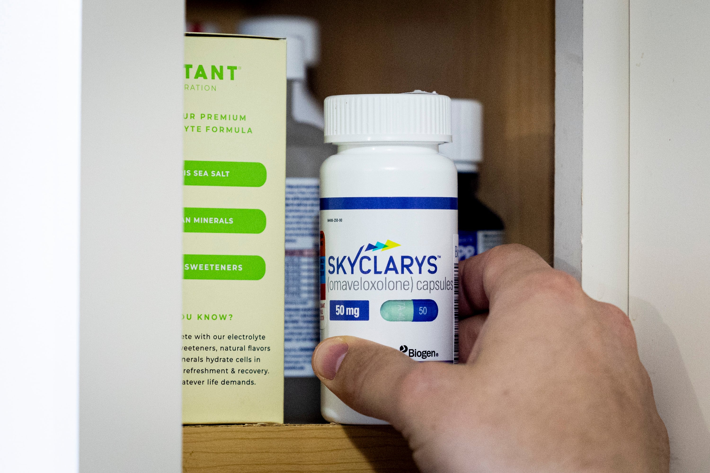 Alex Fransen puts away a medication for his wife, Tiffany, at the their family's home in Highland on Dec. 17.