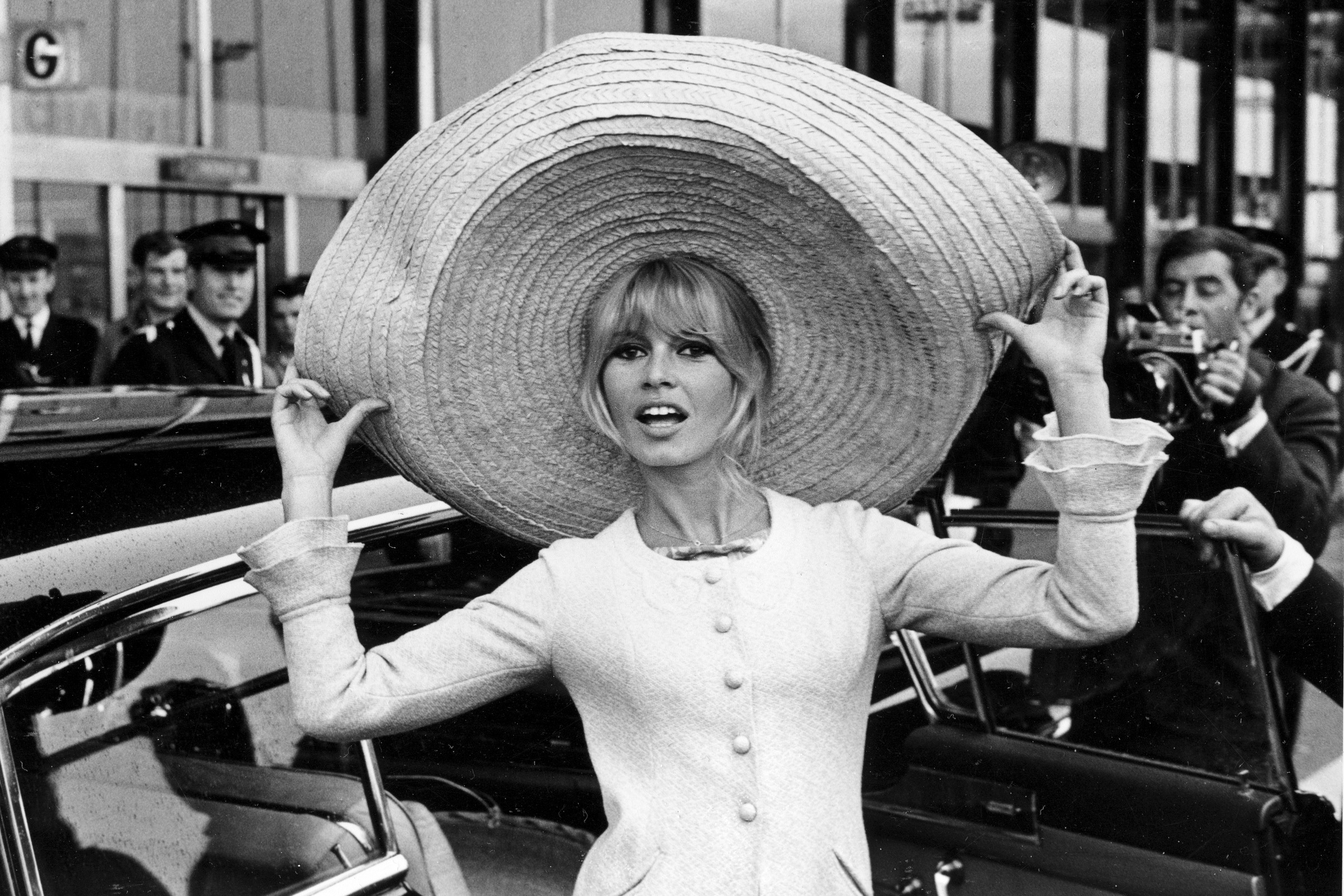 French actress Brigitte Bardot poses with a huge sombrero she brought back from Mexico, as she arrives at Orly Airport in Paris, France, on May 27, 1965. She died Sunday. She was 91.