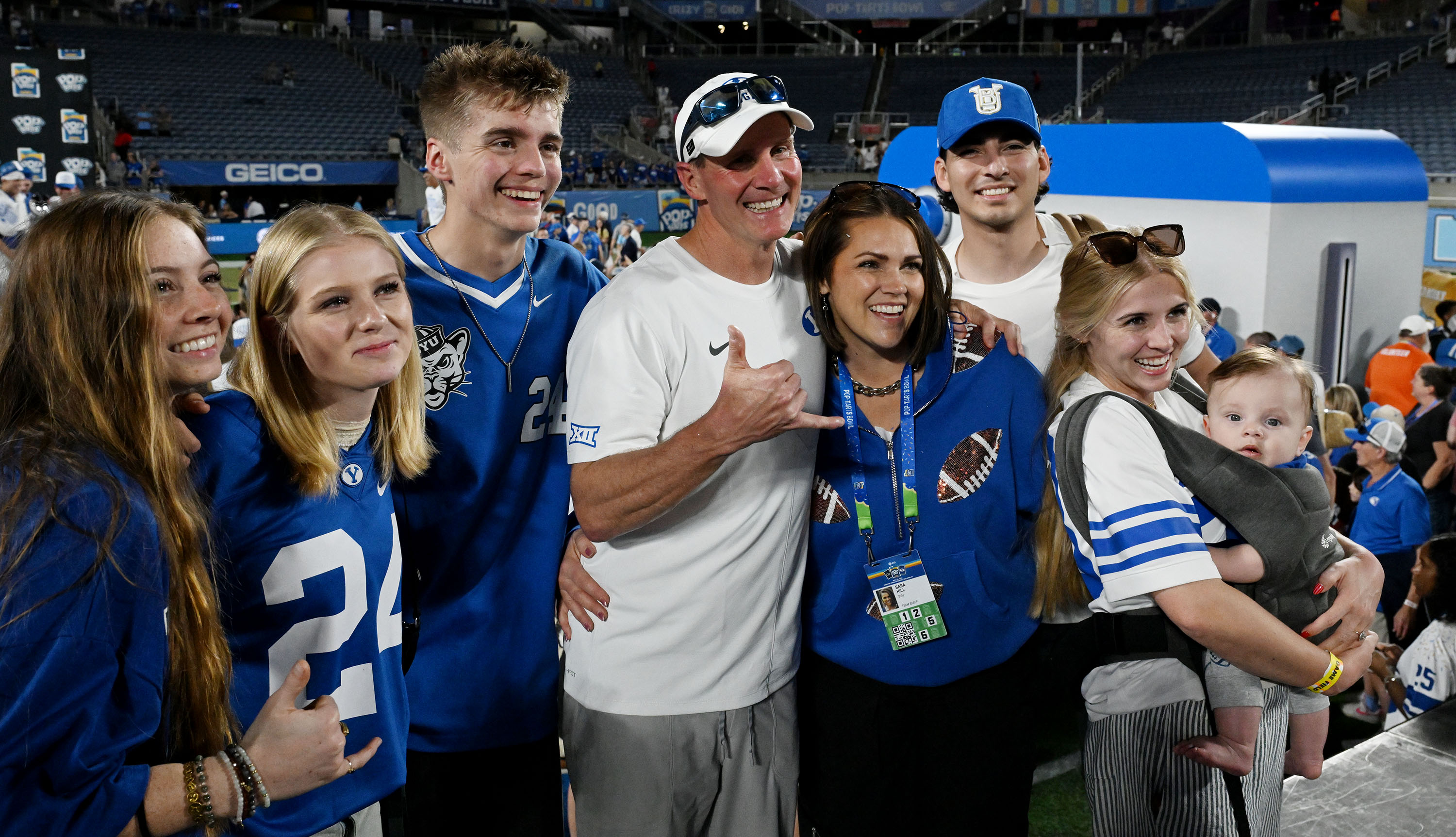 BYU defensive coordinator Jay Hill poses for a photo with members of his family as the Cougars celebrate their win over the Georgia Tech Yellow Jackets in the Pop-Tarts Bowl in Orlando on Saturday, Dec. 28, 2025.