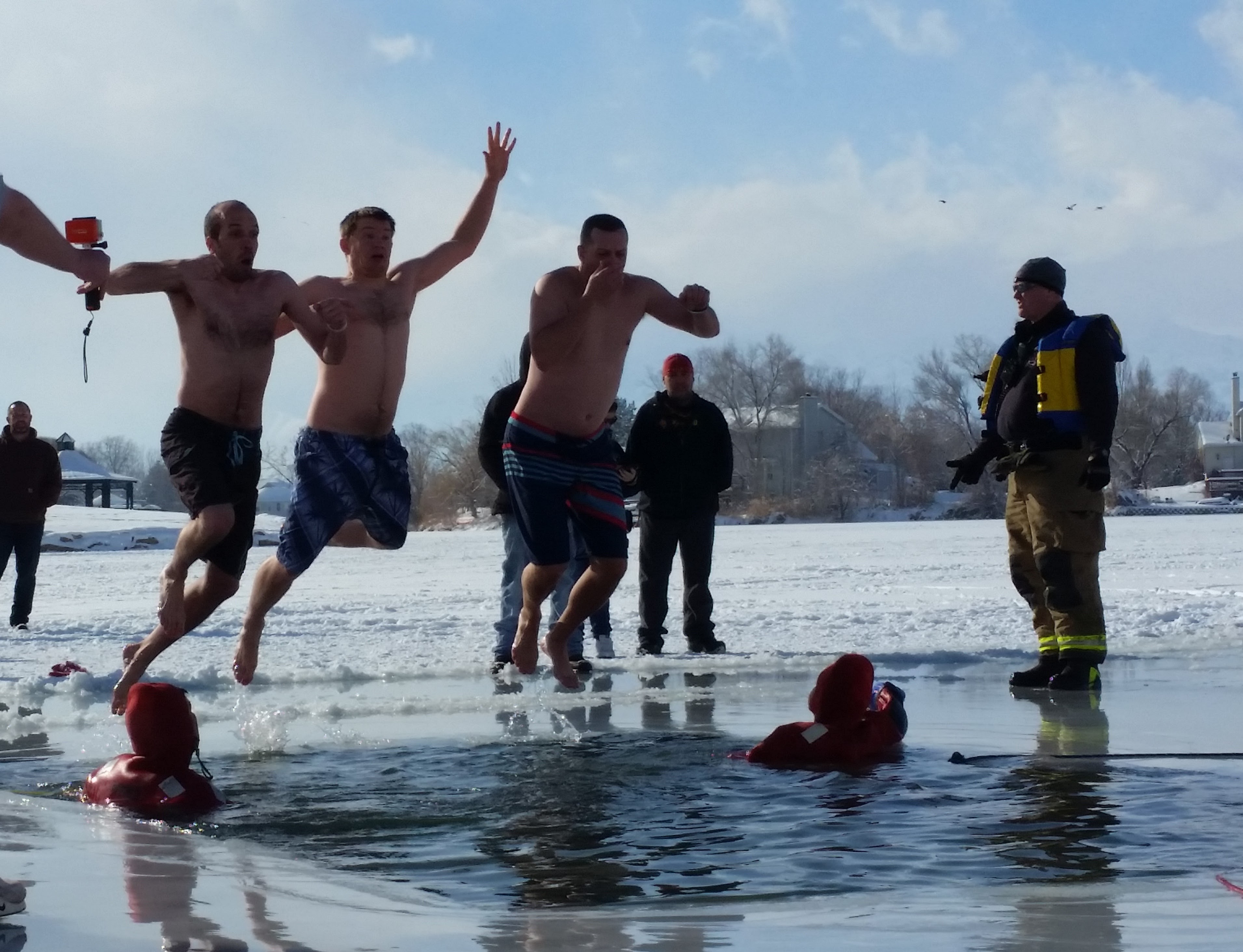 Bryce Arnell, Micah Watson and Darin Arnell during the Ice Breaker Plunge at Stansbury Lake in an undated photo. Community members are invited to splash into 2026 at the annual event on Thursday.