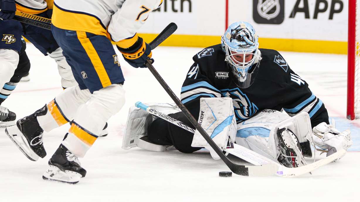 Utah Mammoth goaltender Vítek Van??ek (41) makes a save on Nashville Predators right wing Luke Evangelista (77) during the second period of an NHL game at the Delta Center in Salt Lake City on Monday, Dec. 29, 2025.