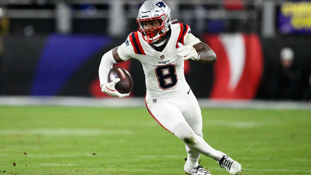 New England Patriots wide receiver Stefon Diggs (8) runs against the Baltimore Ravens during the second half of an NFL football game, Sunday, Dec. 21, 2025, in Baltimore.