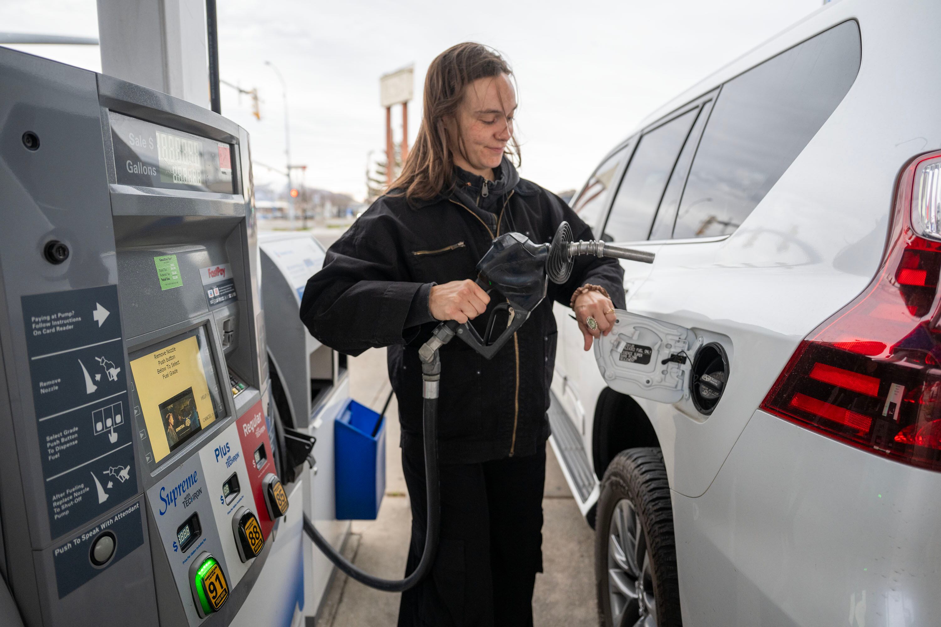 Which residents pay more at the pump due to gas taxes?