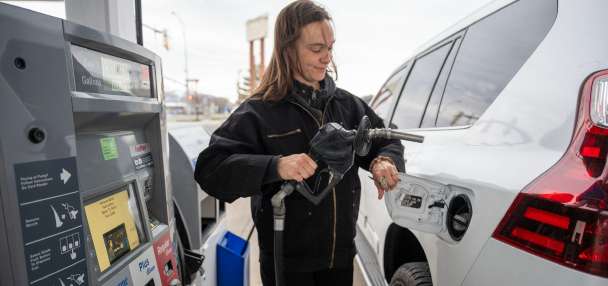 Which residents pay more at the pump due to gas taxes?