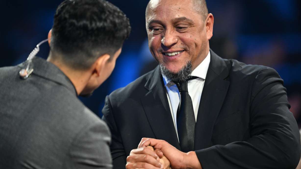 Former Brazil star Roberto Carlos is interviewed by actor Danny Ramirez during the draw for the 2026 soccer World Cup at the Kennedy Center in Washington, Friday, Dec. 5, 2025.