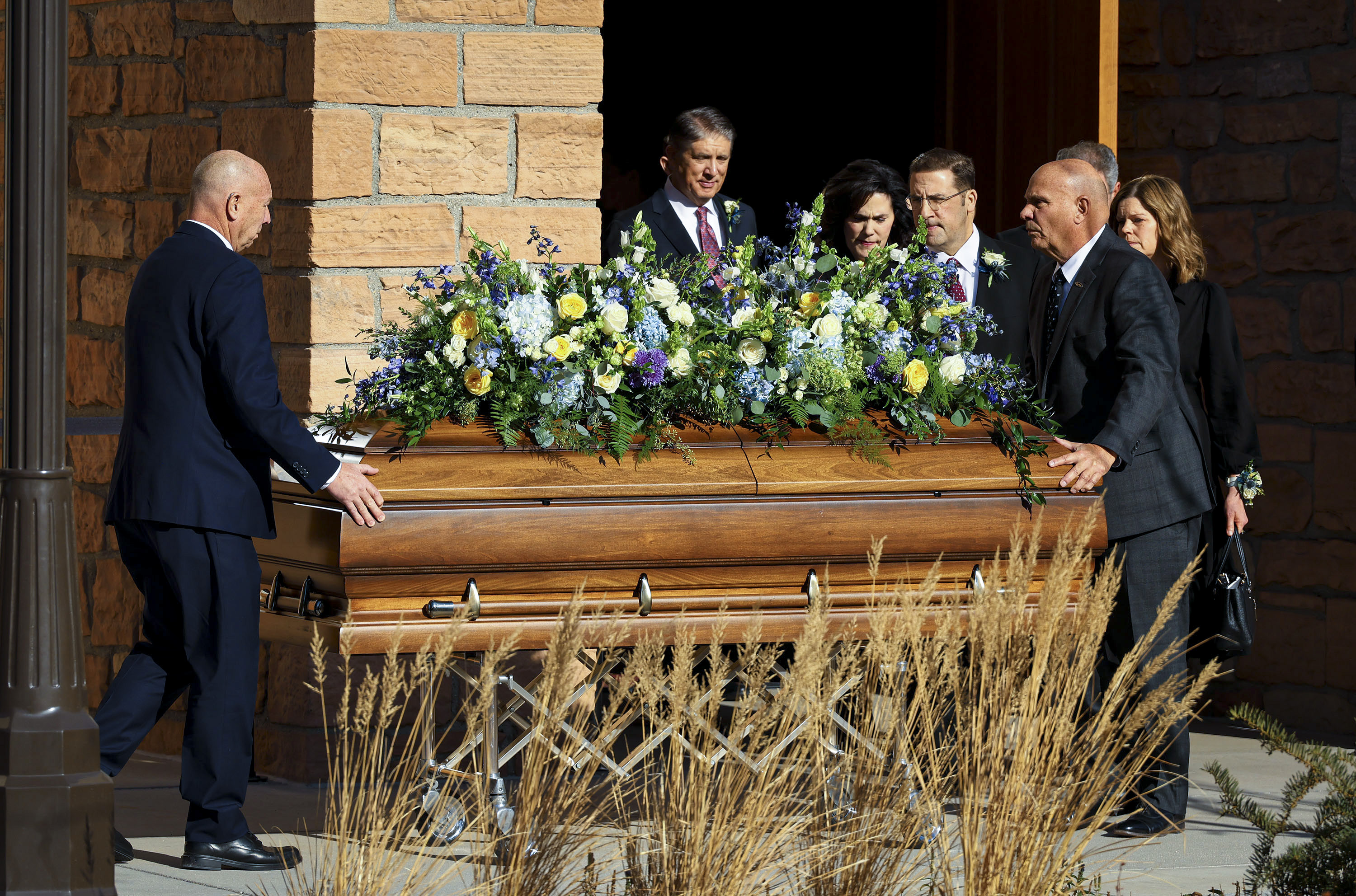 The casket of President Jeffrey R. Holland, president of the Quorum of the Twelve Apostles of The Church of Jesus Christ of Latter-day Saints, is brought out of his funeral at the Salt Lake Tabernacle in Salt Lake City on Wednesday.