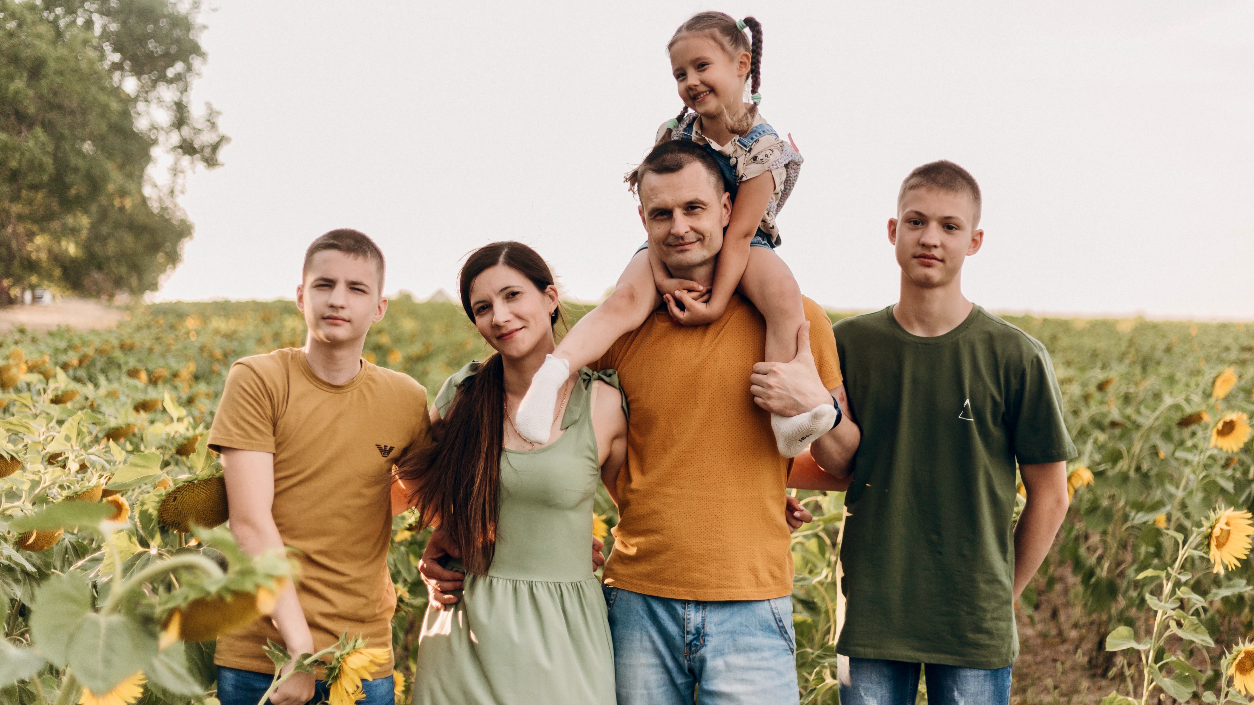 Yurii Ahieiev, center, and his daughter Viktoriia Ahieieva, on his shoulders, came to Utah in 2023 from Ukraine under the Uniting for Ukraine program but now face deportation. They are pictured with the rest of their family in Ukraine before coming to Utah.