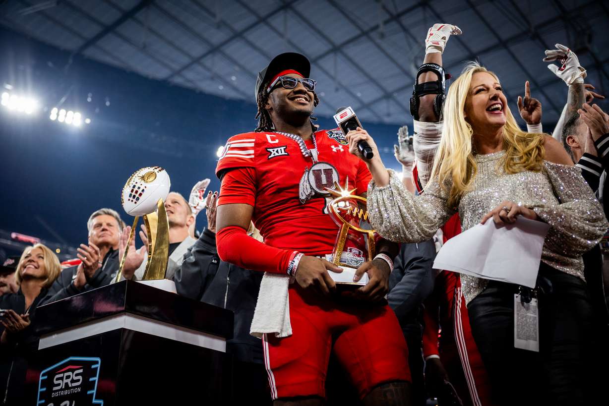 Utah Utes quarterback Devon Dampier (4) holds the trophy given to the Utah Utes for winning the Las Vegas Bowl against the Nebraska Cornhuskers at Allegiant Stadium in Las Vegas on Wednesday, Dec. 31, 2025.
