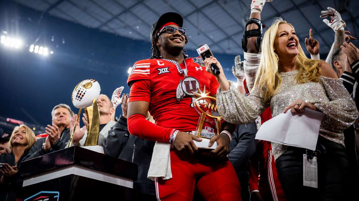 Utah Utes quarterback Devon Dampier (4) holds the trophy given to the Utah Utes for winning the Las Vegas Bowl against the Nebraska Cornhuskers at Allegiant Stadium in Las Vegas on Wednesday, Dec. 31, 2025.