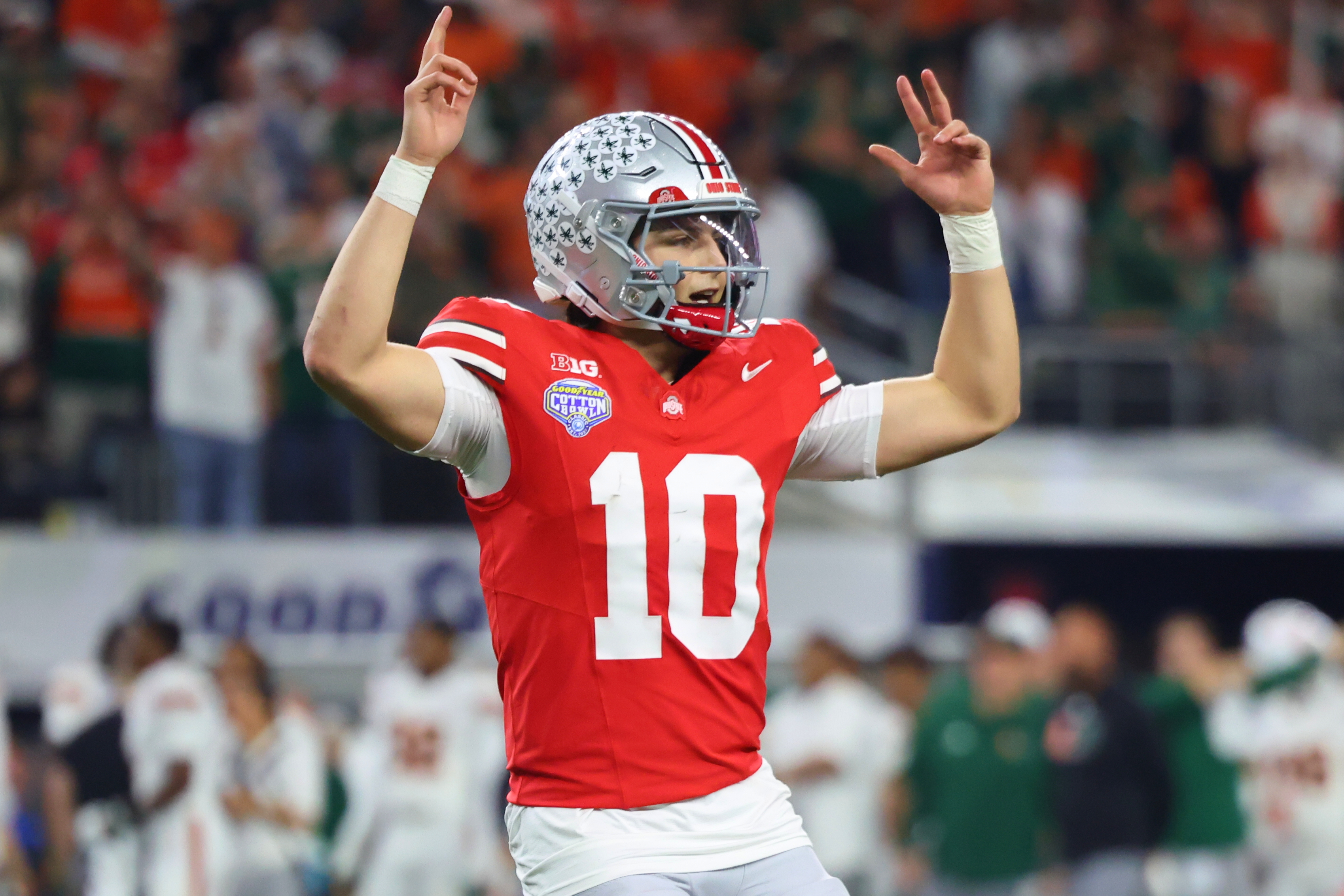 Ohio State quarterback Julian Sayin reacts after throwing a touchdown pass against Miami during the second half of the Cotton Bowl College Football Playoff quarterfinal game Wednesday, Dec. 31, 2025, in Arlington, Texas.