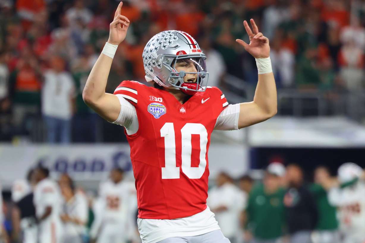 Ohio State quarterback Julian Sayin reacts after throwing a touchdown pass against Miami during the second half of the Cotton Bowl College Football Playoff quarterfinal game Wednesday, Dec. 31, 2025, in Arlington, Texas.