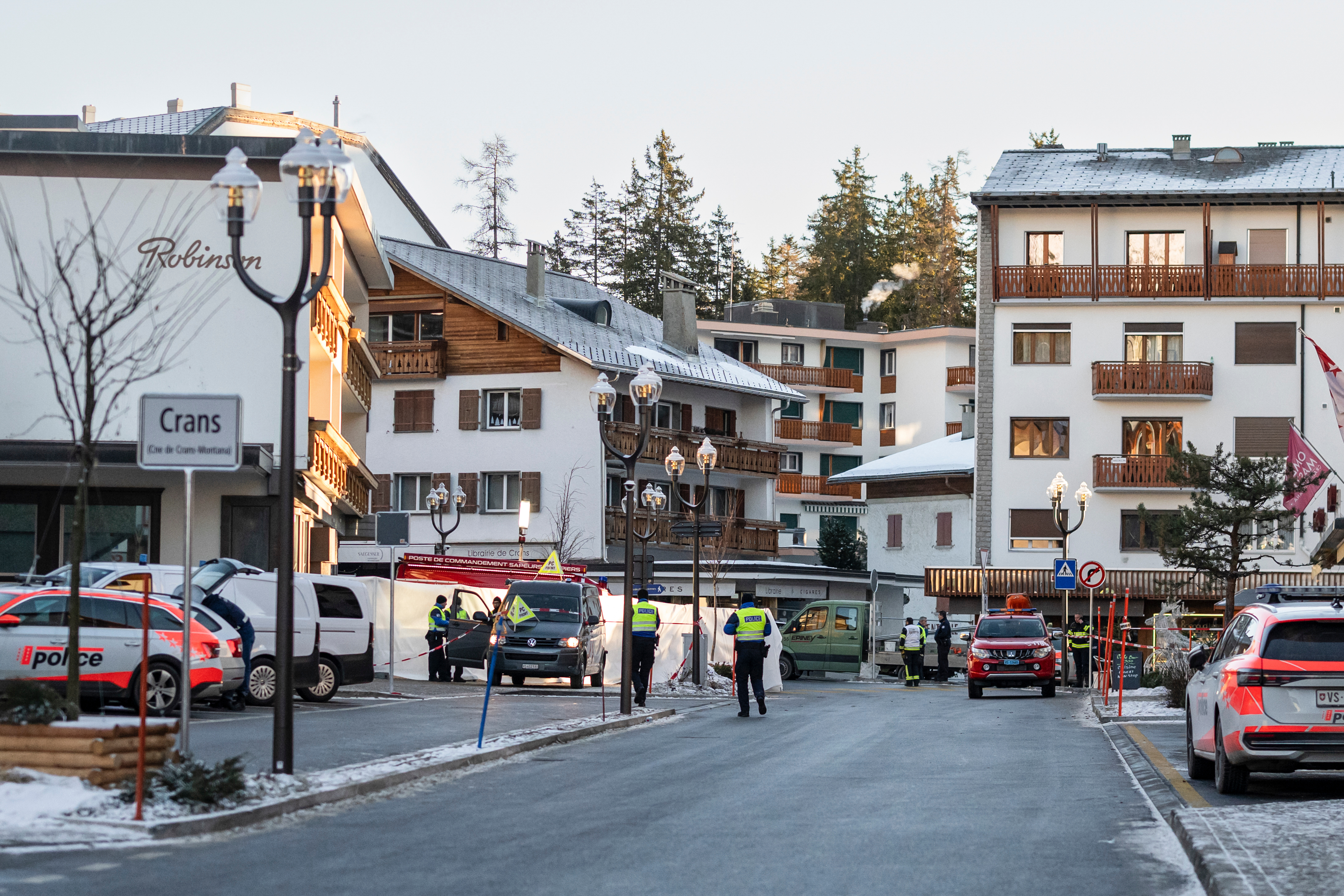 Police officers inspect the area where a fire broke out at the Le Constellation bar and lounge leaving people dead and injured, during New Year’s celebration, in Crans-Montana, Swiss Alps, Switzerland, Thursday. Officials have not been able to access the wreckage.