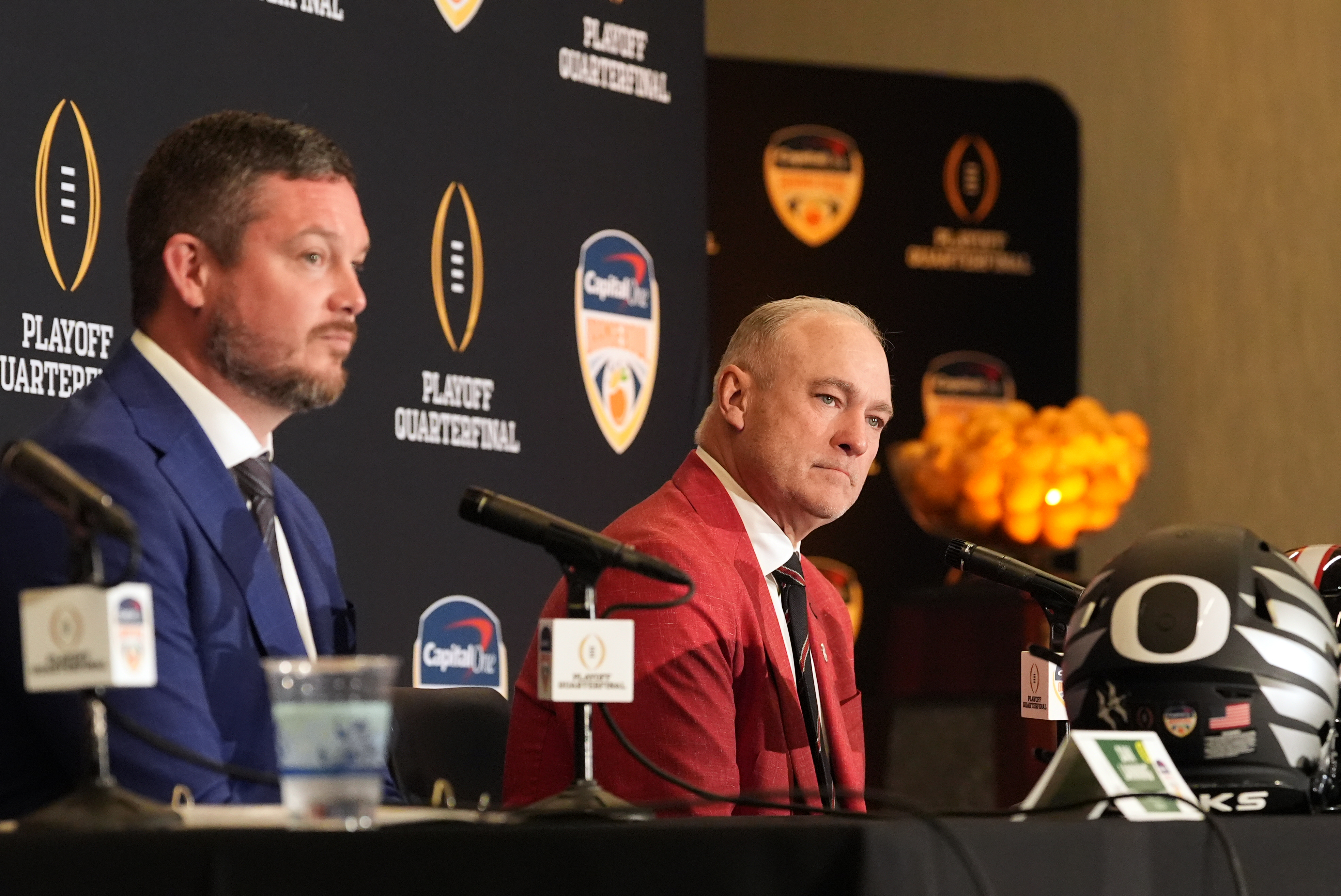 Texas Tech head coach Joey McGuire, right, and Oregon head coach Dan Lanning participate in a press conference ahead of the Orange Bowl College Football Playoff quarterfinal game, Wednesday, Dec. 31, 2025, in Dania Beach, Fla.