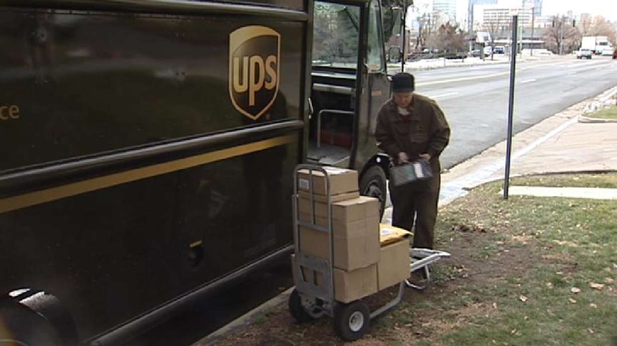 UPS drivers working hard deliver Christmas presents on time