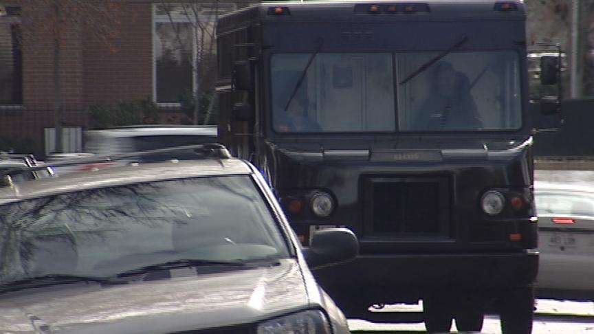 UPS drivers working hard deliver Christmas presents on time