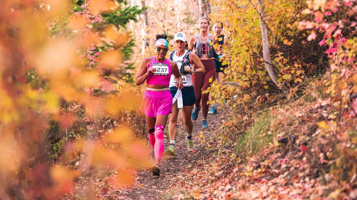 Participants run down a mountain during the Women's Epic Race held at Deer Valley Resort in Park City on Sept. 27.