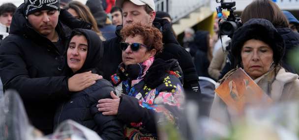 Swiss investigators believe sparkling flares atop wine bottles ignited fatal bar fire