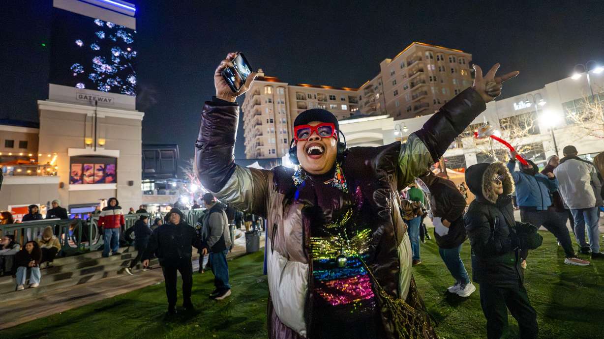 Ava Cabey dances and sings as she and other people enjoy the Last Hurrah 2025 celebration at the Gateway in Salt Lake City on Dec. 31, 2025. Over 600,000 square feet of open-air retail and other space at the Gateway went up for sale on Tuesday.