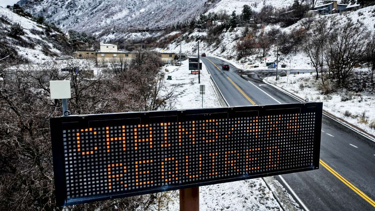A sign for the canyon traction law is displayed at the mouth of Big Cottonwood Canyon in Cottonwood Heights on Dec. 27. An active pattern of rain and snow remains in Utah's forecast for next week after a productive New Year's storm.