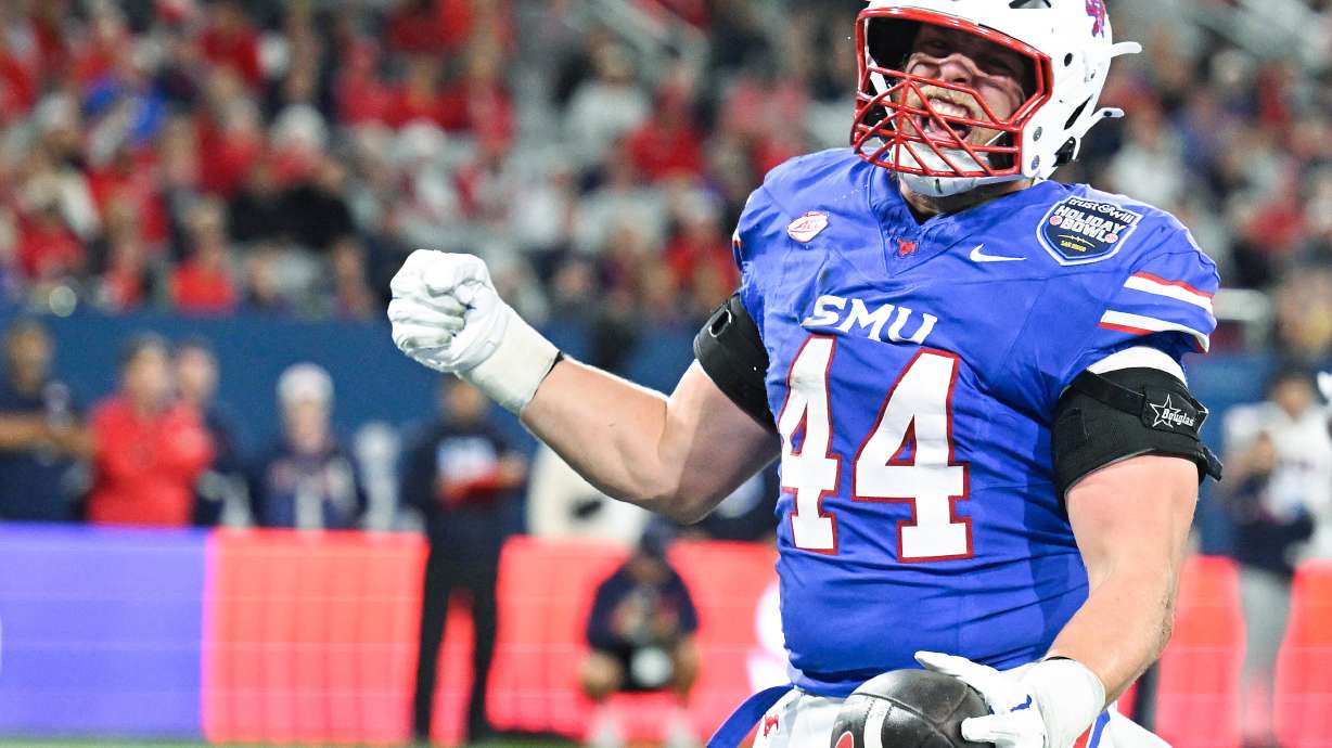 SMU tight end Stone Eby (44) celebrates after scoring a touchdown during the first half of the Holiday Bowl NCAA college football game against Arizona Friday, Jan. 2, 2026, in San Diego.