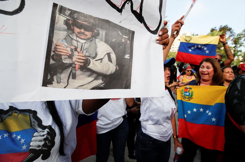 Venezuelans celebrate after President Donald Trump said the U.S. struck Venezuela and captured President Nicolas Maduro and his wife Cilia Flores, in Vina del Mar, Chile, Saturday. Reactions were divided across the political spectrum.
