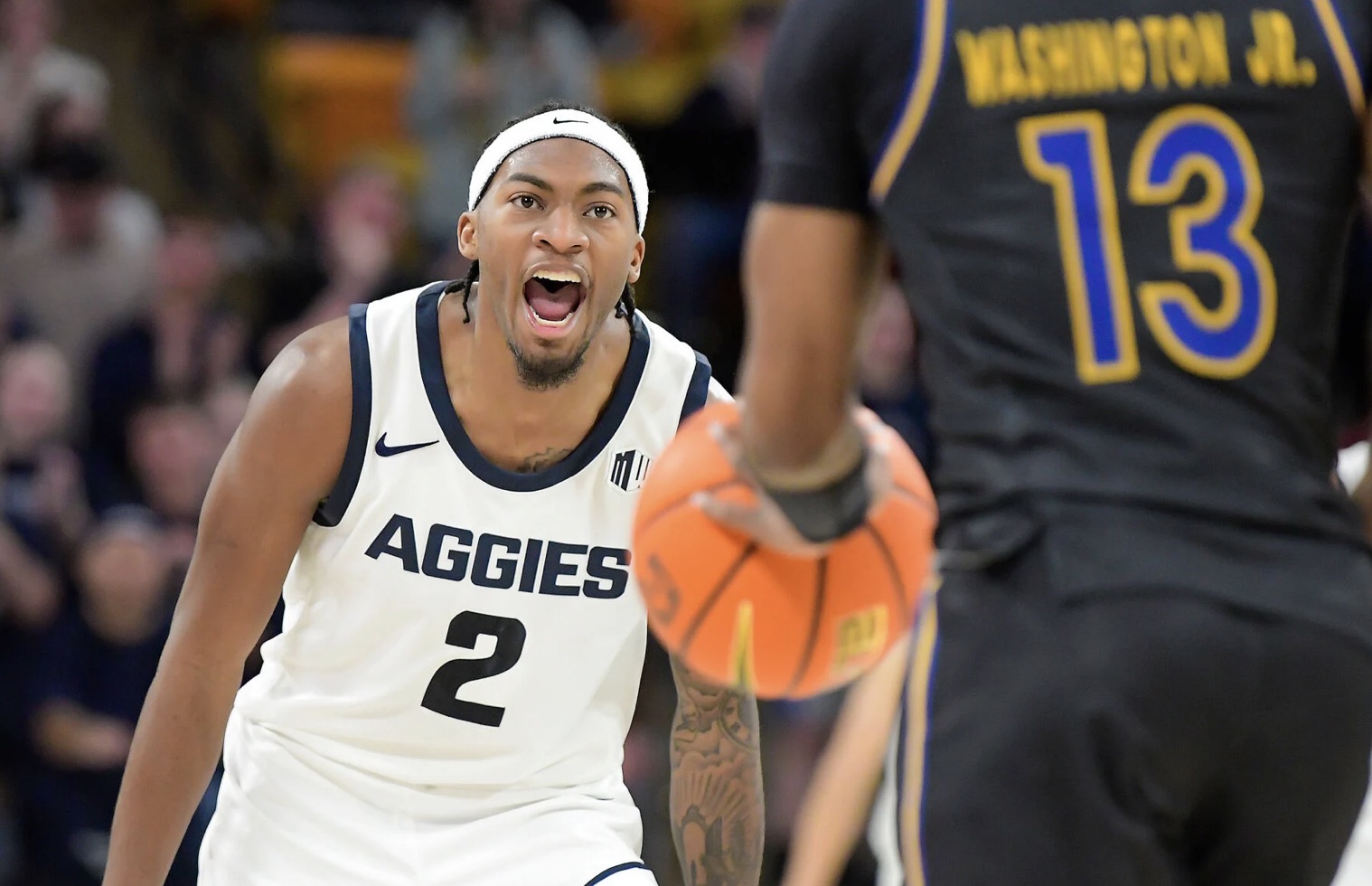 Aggies men break close game open in final six minutes over Spartans