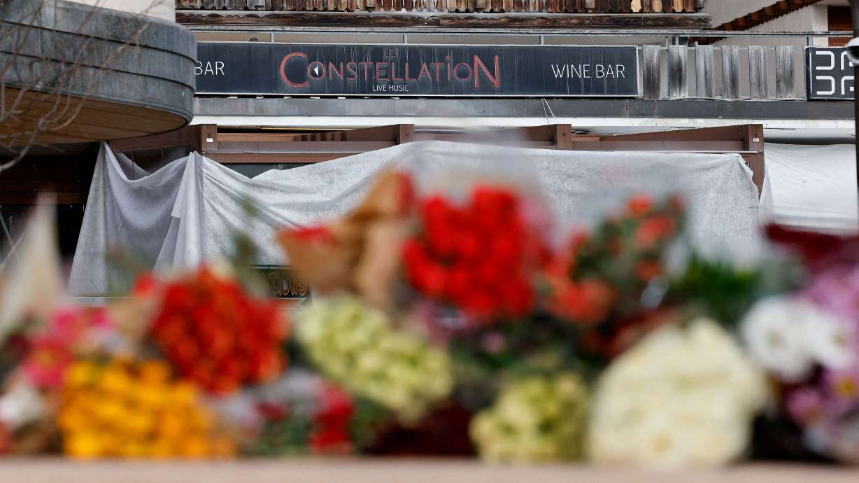 Flowers laid near Le Constellation bar in the ski resort of Crans-Montana in Switzerland on Saturday.
