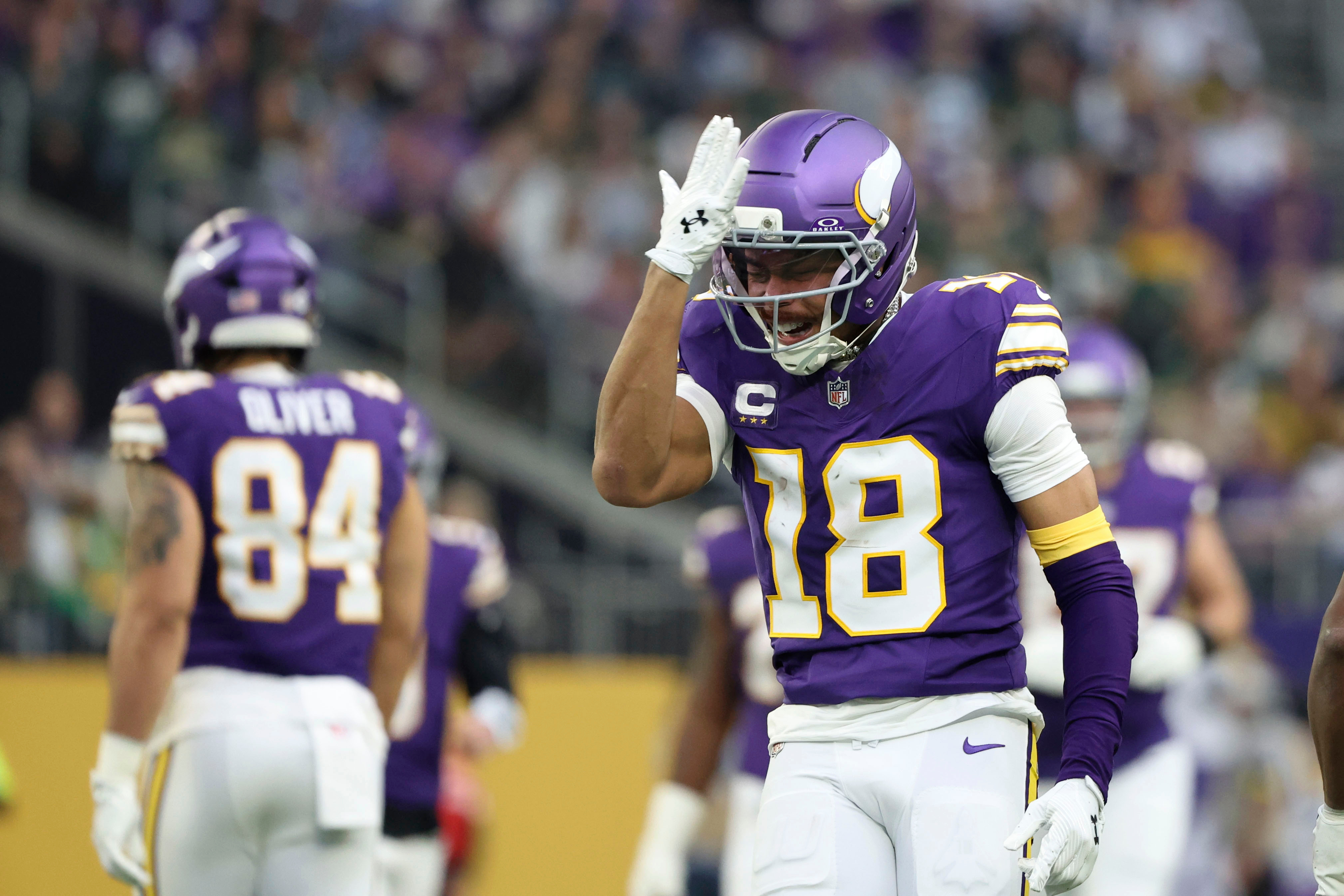 Minnesota Vikings wide receiver Justin Jefferson (18) reacts after catching a pass during the first half of an NFL football game against the Green Bay Packers, Sunday, Jan. 4, 2026, in Minneapolis.