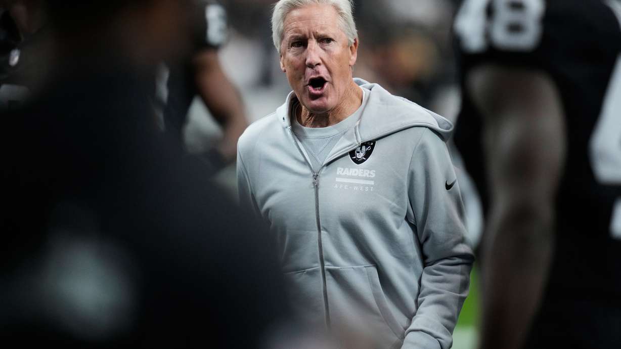 Las Vegas Raiders head coach Pete Carroll watches his team warm up before an NFL football game against the Kansas City Chiefs Sunday, Jan. 4, 2026, in Las Vegas.