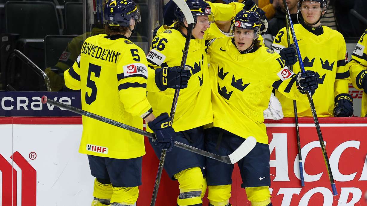 Sweden forward Ivar Stenberg, right, celebrates his goal with teammates during the second period of an IIHF World Junior Hockey Championship semifinals game against Finland, Sunday, Jan. 4, 2026, in St. Paul, Minn.